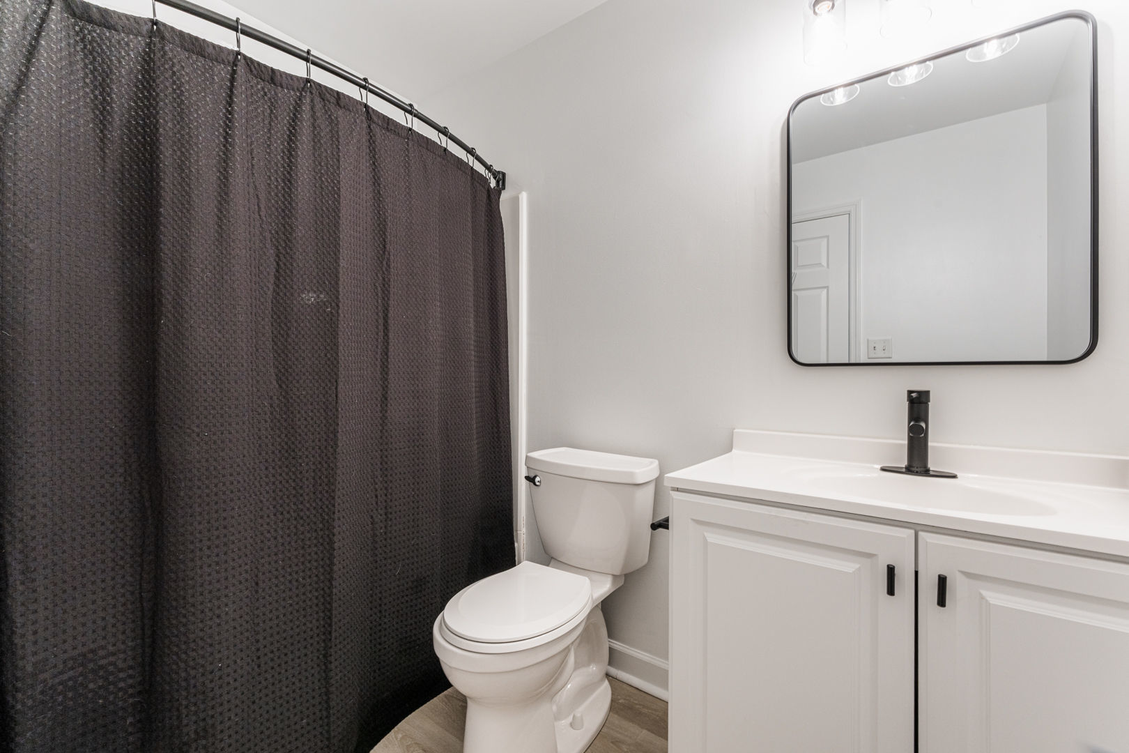 2117 Frantum Road Sycamore, IL 60178 - Photo 16 of 24 a bathroom with a toilet sink and mirror
