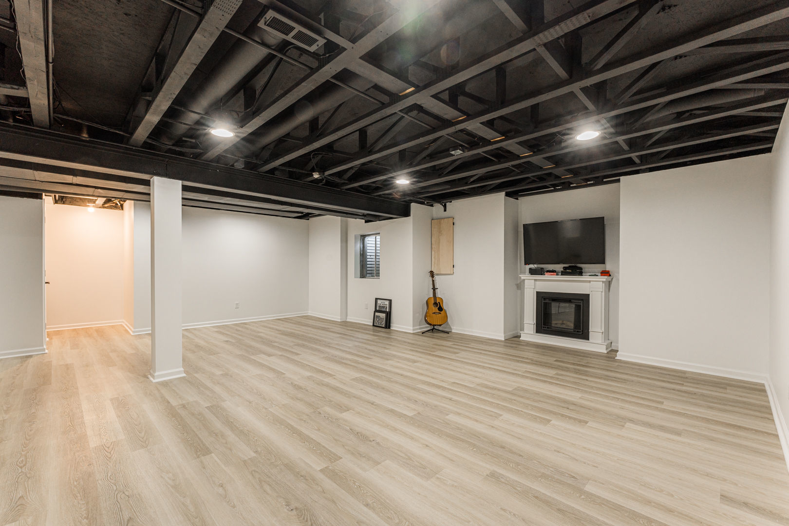 2117 Frantum Road Sycamore, IL 60178 - Photo 21 of 24 a view of an empty room with wooden floor and a ceiling fan