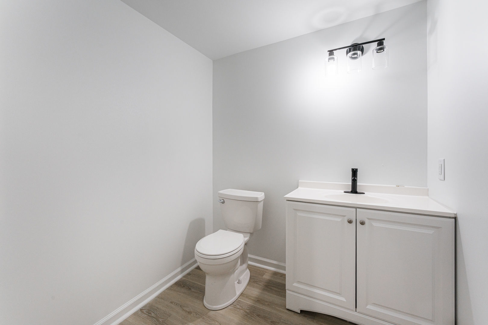 2117 Frantum Road Sycamore, IL 60178 - Photo 22 of 24 a white toilet sitting next to a bathroom sink