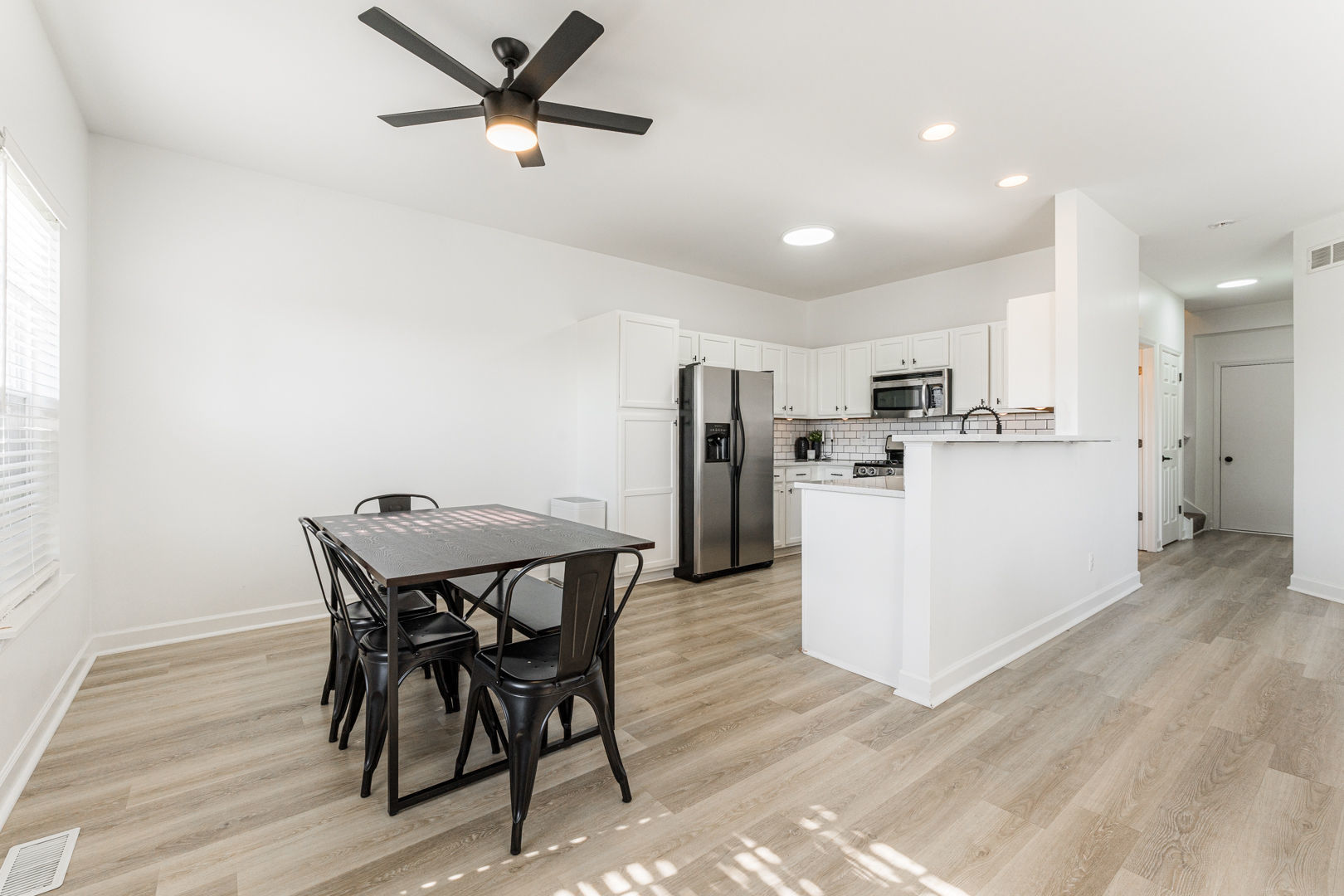 2117 Frantum Road Sycamore, IL 60178 - Photo 5 of 24 a view of a dining room with furniture and wooden floor