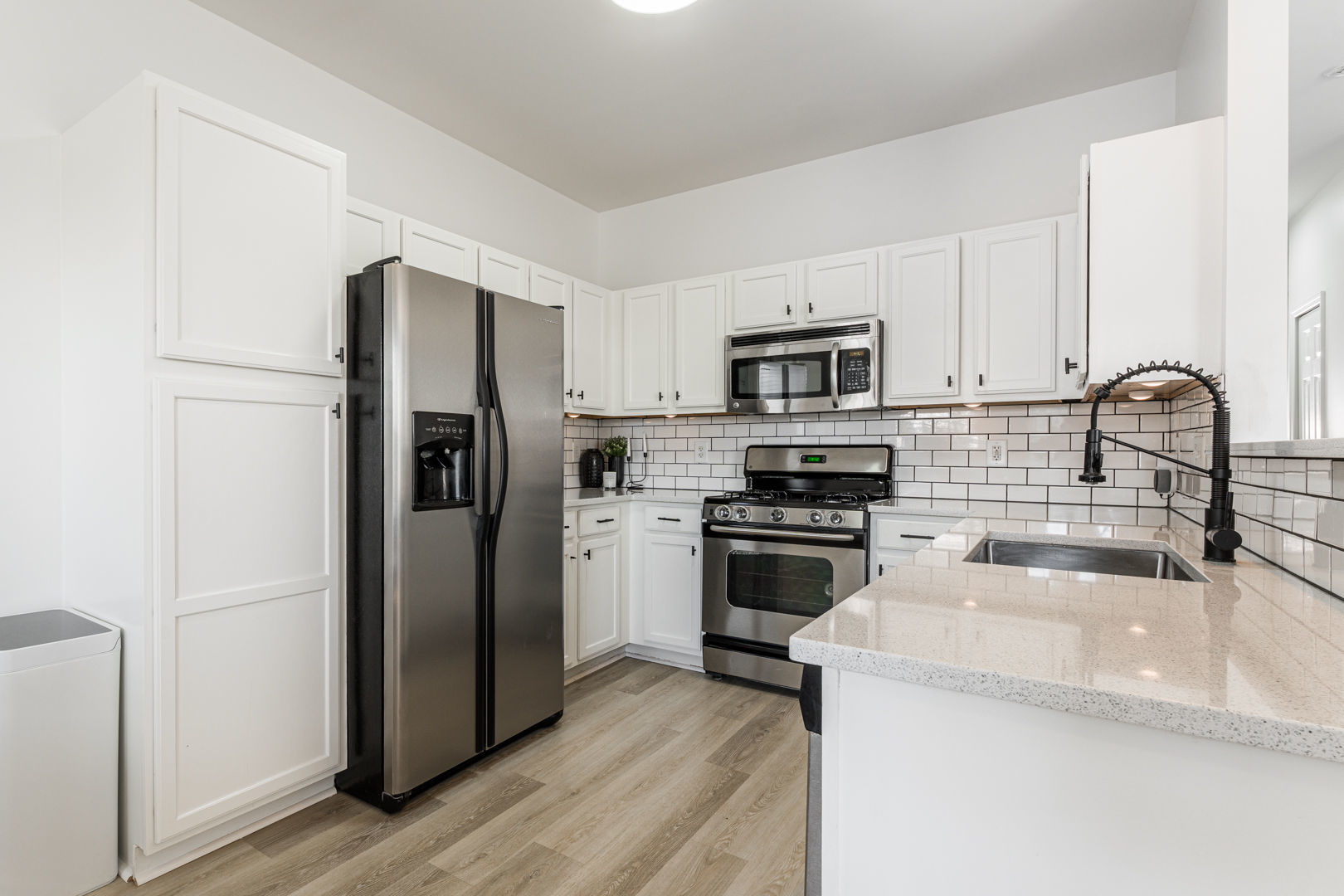2117 Frantum Road Sycamore, IL 60178 - Photo 6 of 24 a kitchen with a refrigerator stove and microwave