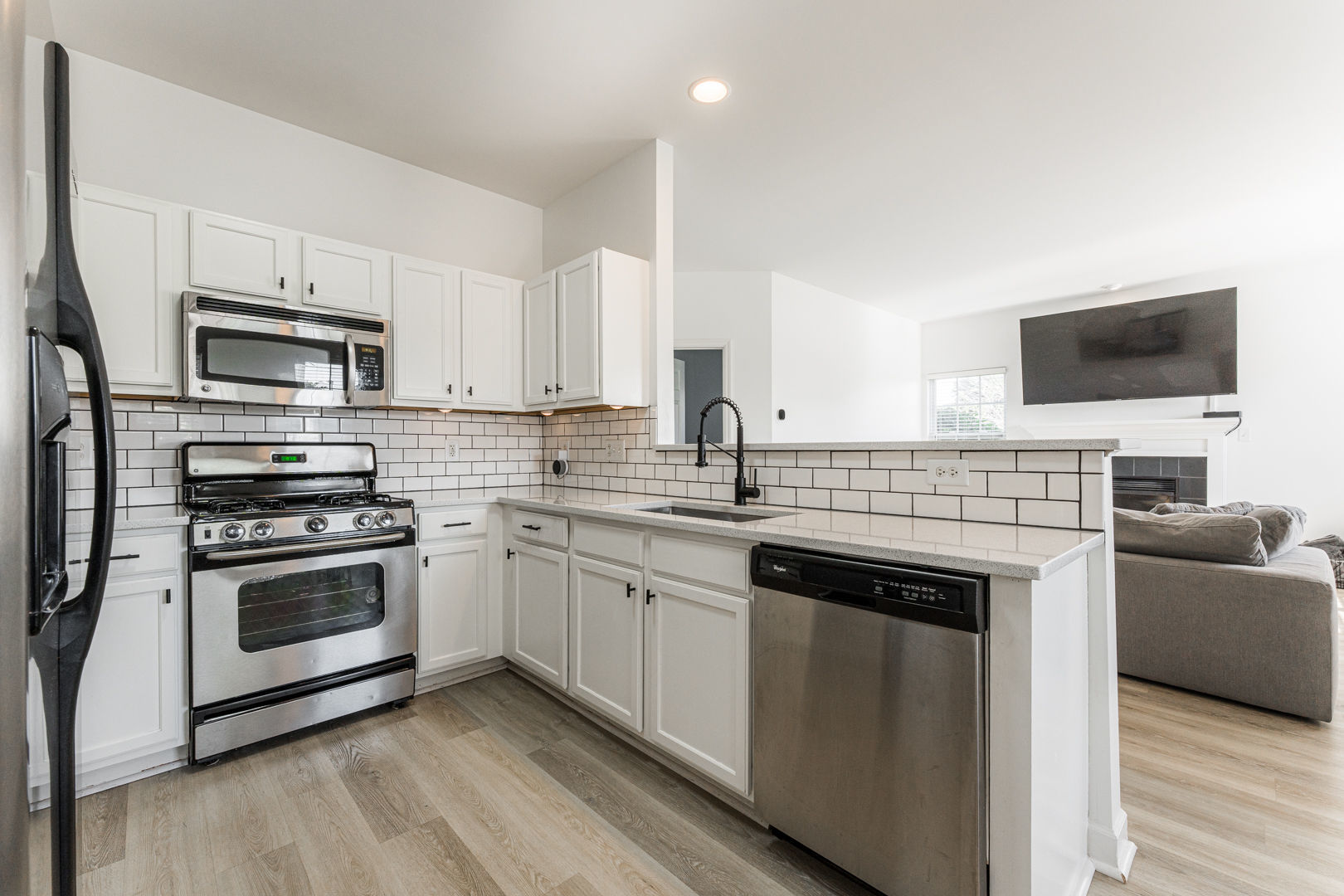2117 Frantum Road Sycamore, IL 60178 - Photo 7 of 24 a kitchen with stainless steel appliances a stove a sink and a microwave