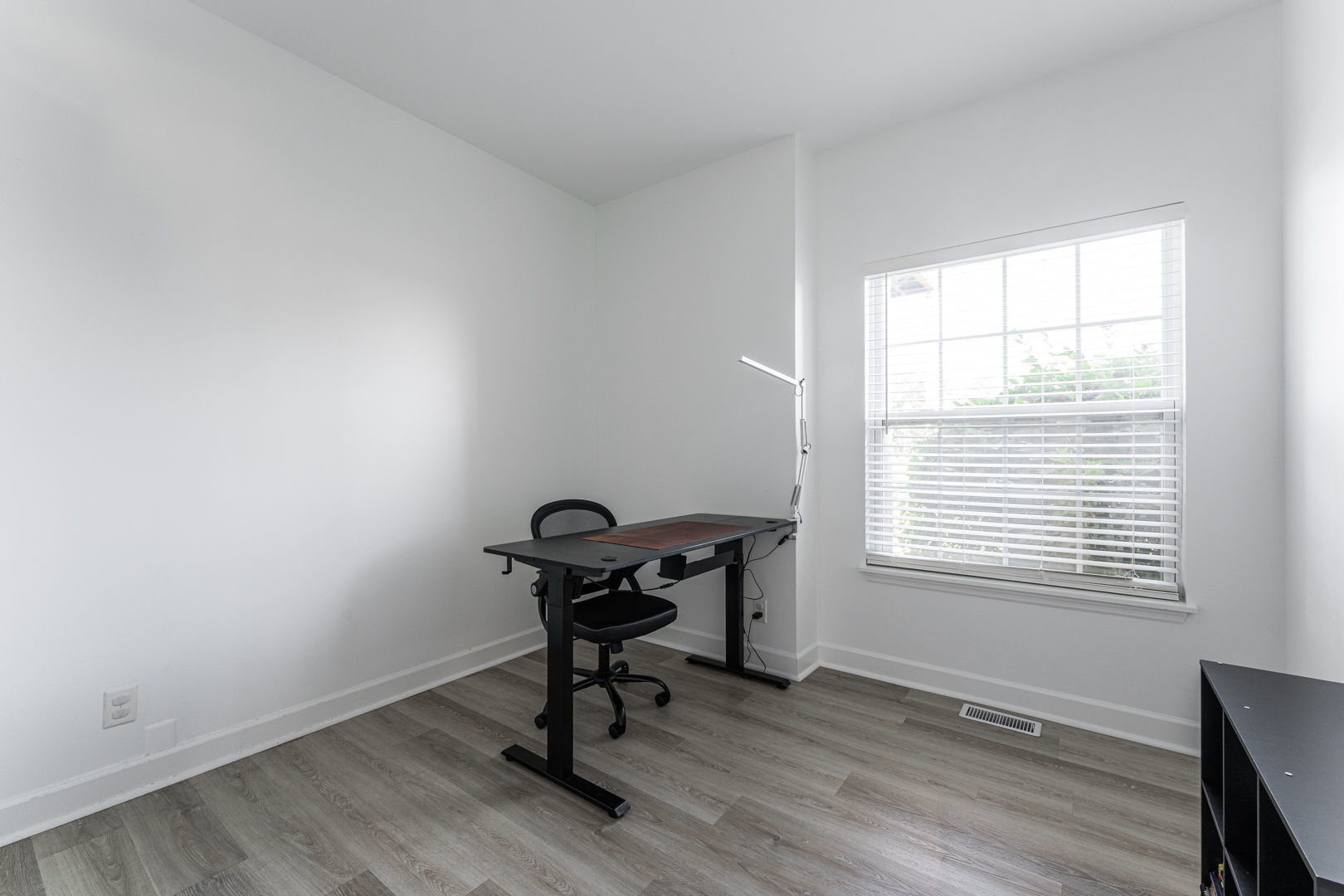 2117 Frantum Road Sycamore, IL 60178 - Photo 8 of 24 a view of a workspace with wooden floor and a window