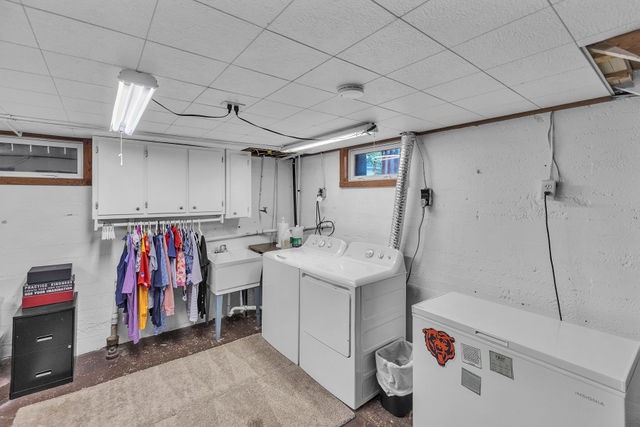 4170 North Taylor Avenue Decatur, IL 62526 - Photo 22 of 29 a storage room with washer and dryer