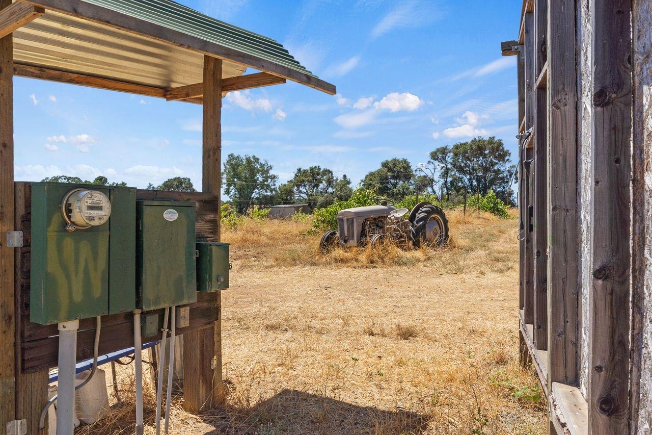 21226 Dickson Road Plymouth, CA 95669 - Photo 25 of 36 a view of a balcony with floor to ceiling windows with wooden floor