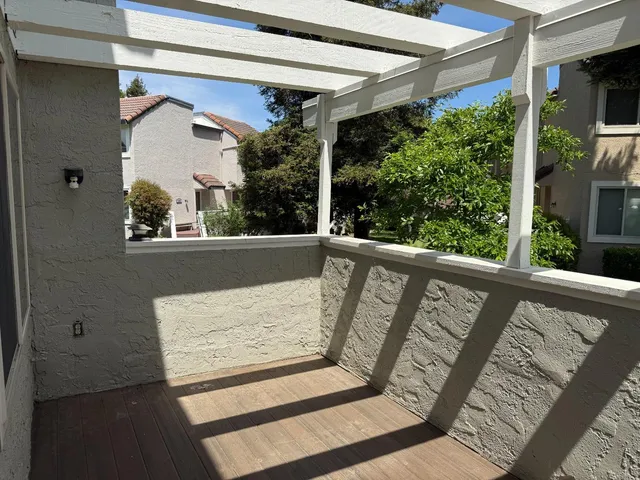 a view of balcony with furniture