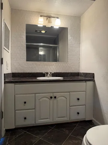 an empty room with wooden door