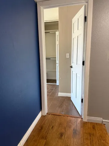 a view of a livingroom with an empty space and a window