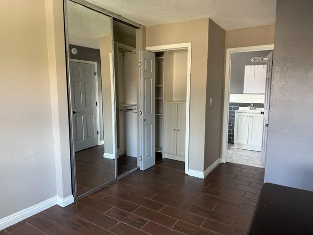 a bathroom with a toilet a sink and a mirror