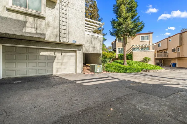 a view of a garden with a house