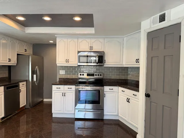 a view of balcony with furniture