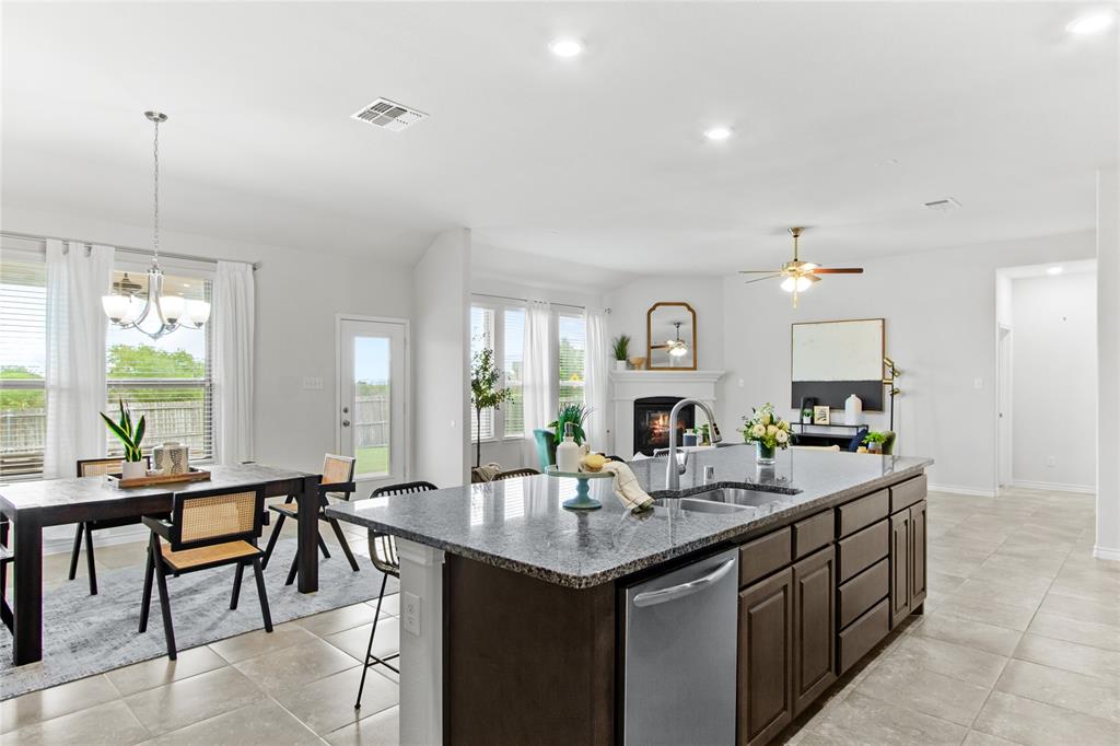 3100 Rademaker Drive Heath, TX 75126 - Photo 11 of 26 a kitchen with a sink and stove