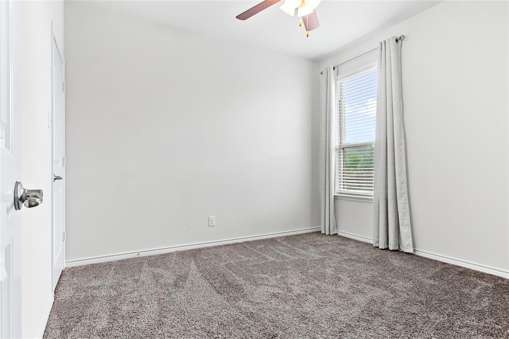 3100 Rademaker Drive Heath, TX 75126 - Photo 22 of 26 an empty room with windows