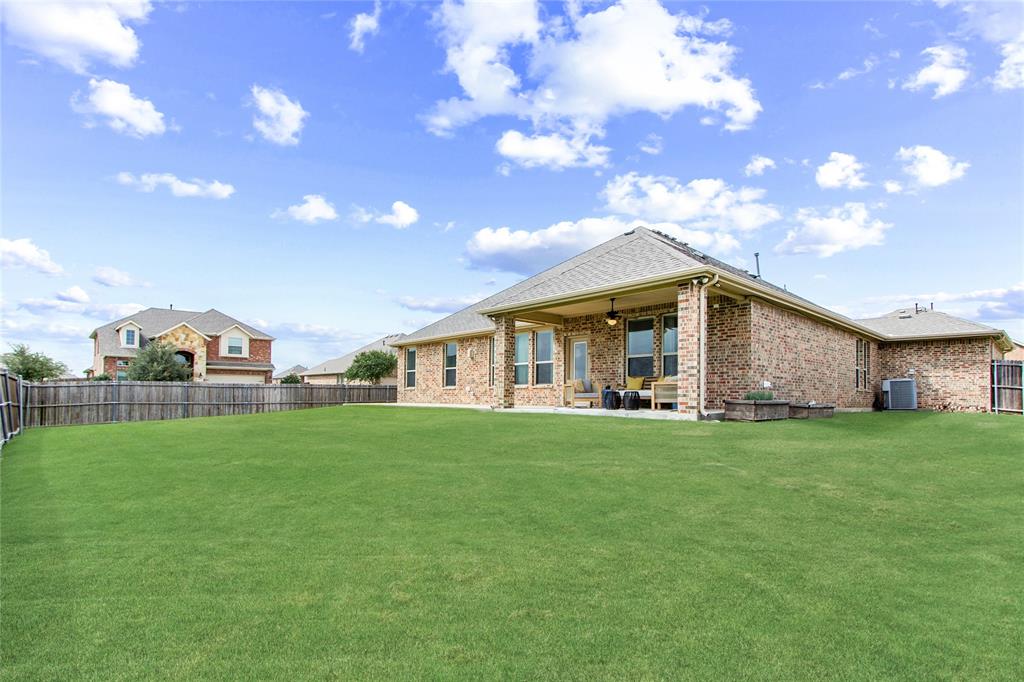 3100 Rademaker Drive Heath, TX 75126 - Photo 24 of 26 a front view of house with yard barbeque and outdoor seating