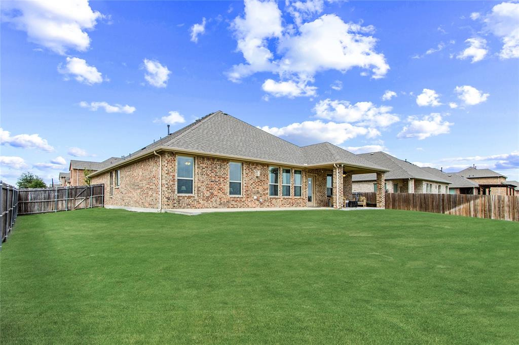 3100 Rademaker Drive Heath, TX 75126 - Photo 6 of 26 a front view of a house with garden