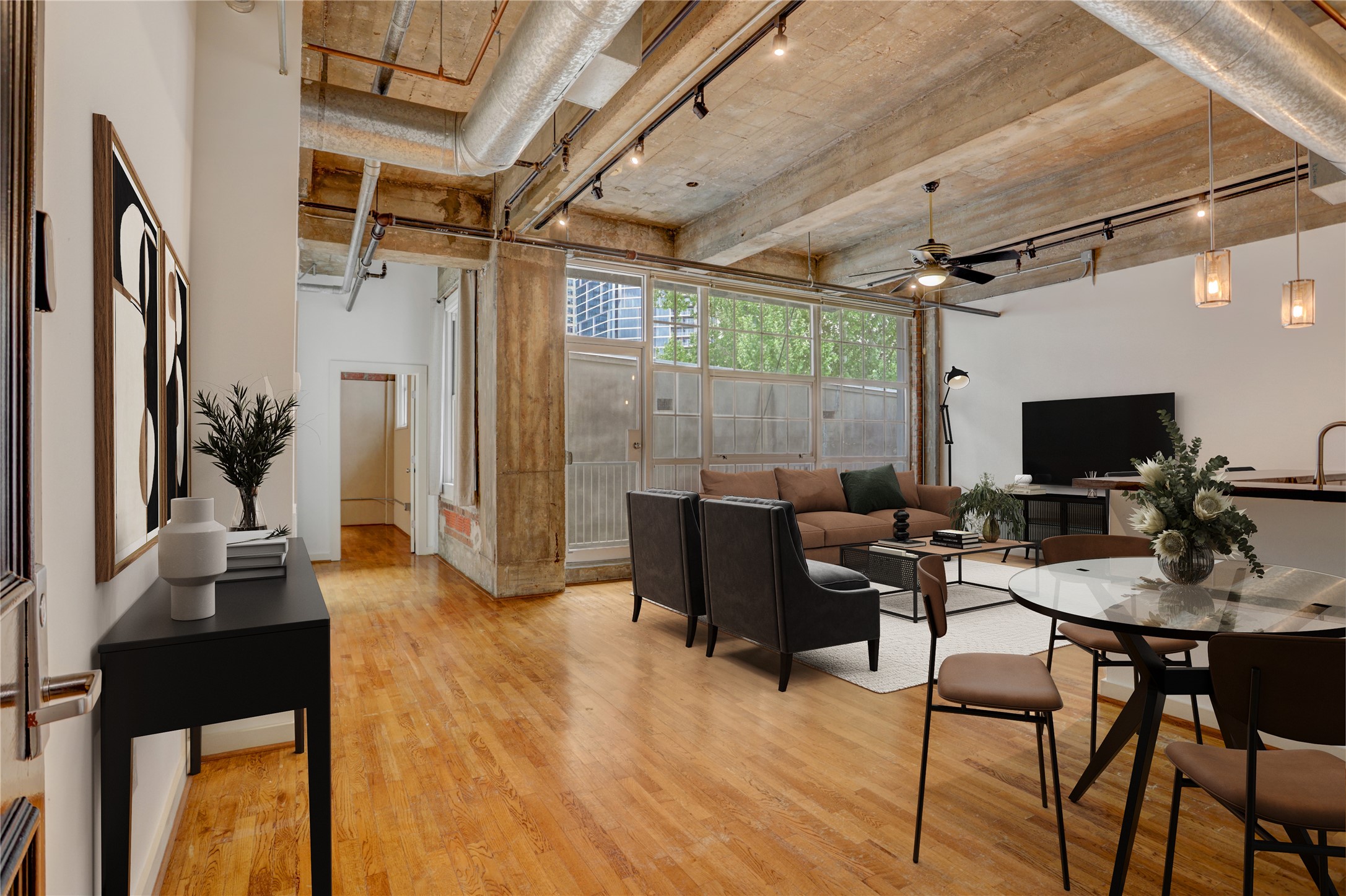a view of a livingroom with furniture and a flat screen tv
