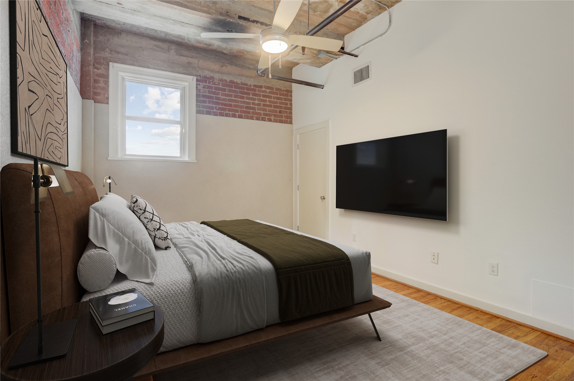 204 Travis Street, Unit 4D Houston, TX 77002 - Photo 7 of 22 a bedroom with bed and tv