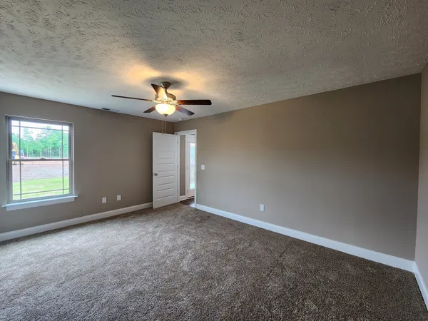 an empty room with closet area