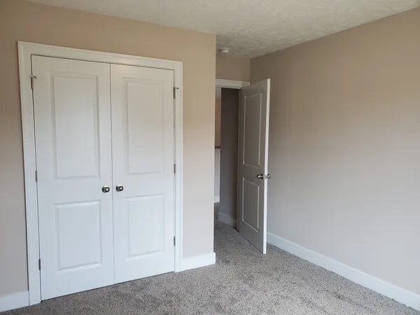 a view of storage and utility room with a window