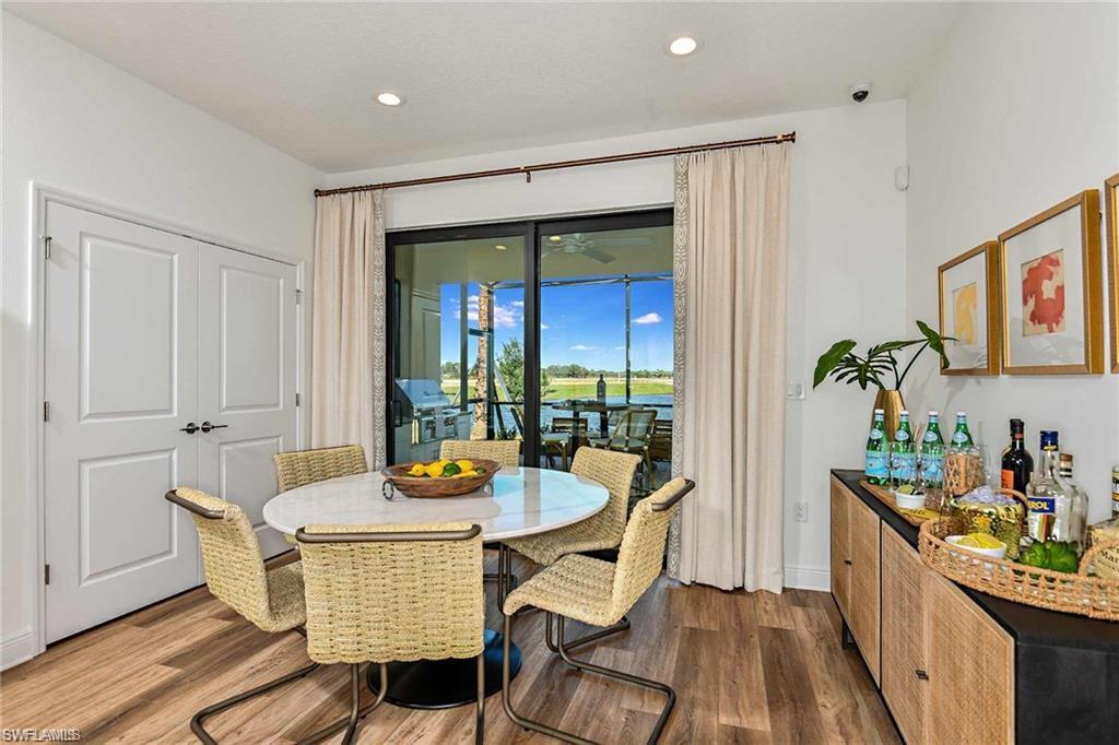 4563 Centaurus Circle Naples, FL 34120 - Photo 6 of 20 a dining room with furniture and window