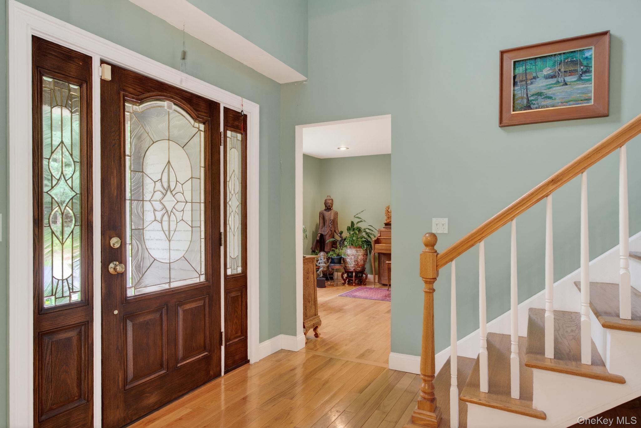 189 Bush Road Stone Ridge, NY 12484 - Photo 6 of 49 a view of an entryway with wooden floor and windows