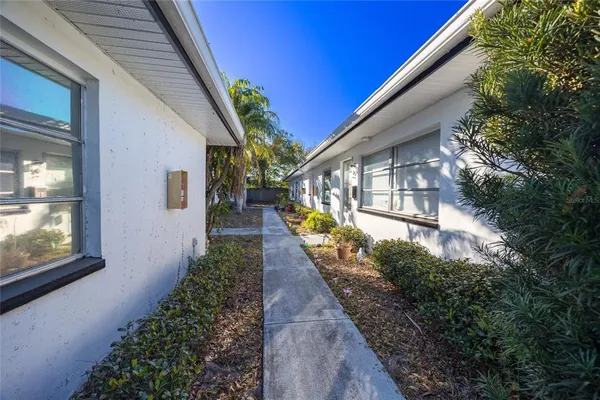 a view of a house with a small yard