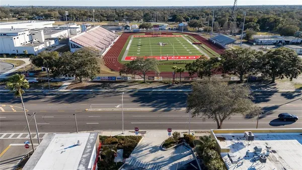 an aerial view of residential houses and outdoor space