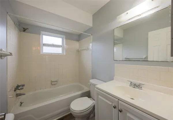 a bathroom with a sink a toilet and a bathtub