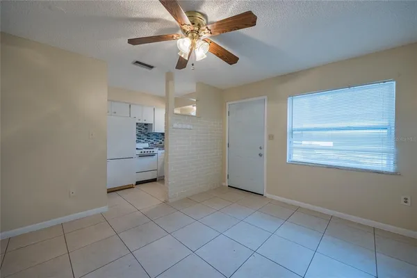 a view of an empty room with a window