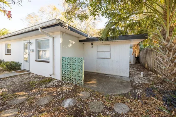 a view of a house with a yard and garage