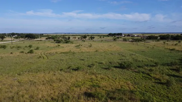 a view of a lake from a yard