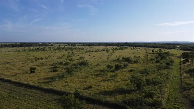 a view of a lake with a building in back