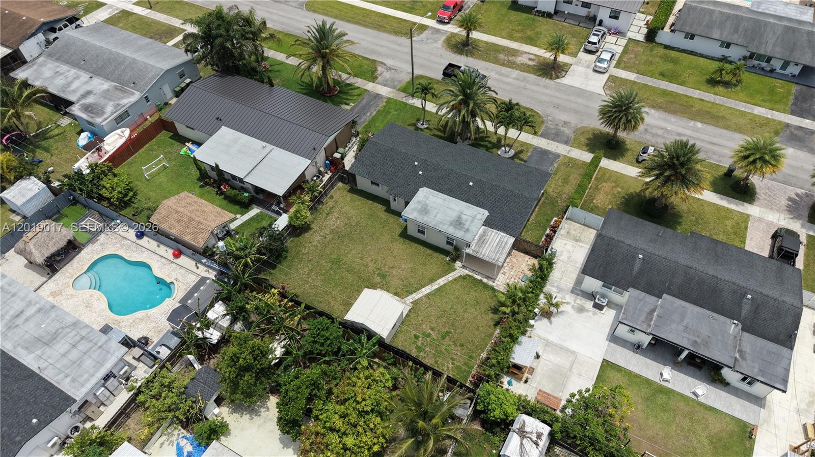 731 Northwest 17th Street Homestead, FL 33030 - Photo 25 of 29 an aerial view of residential houses with outdoor space