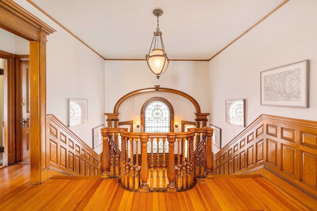 61 Centre Street Brookline, MA 02446 - Photo 14 of 31 a view of a wooden chairs in a balcony