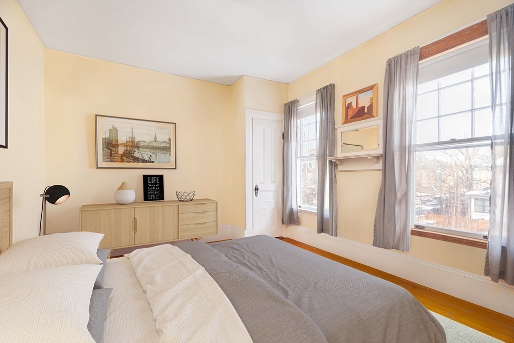 61 Centre Street Brookline, MA 02446 - Photo 16 of 31 a bedroom with a large bed and a large window