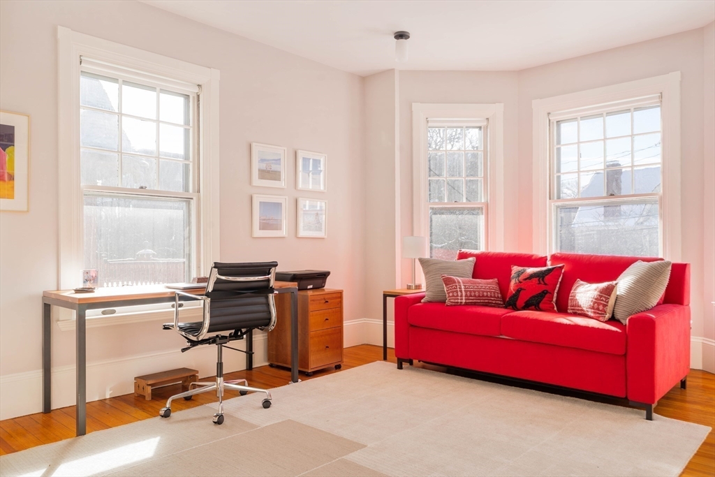 61 Centre Street Brookline, MA 02446 - Photo 23 of 31 a living room with furniture and a window