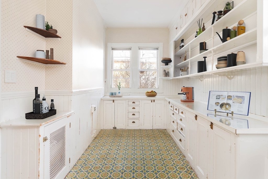 61 Centre Street Brookline, MA 02446 - Photo 25 of 31 a kitchen with cabinets and window