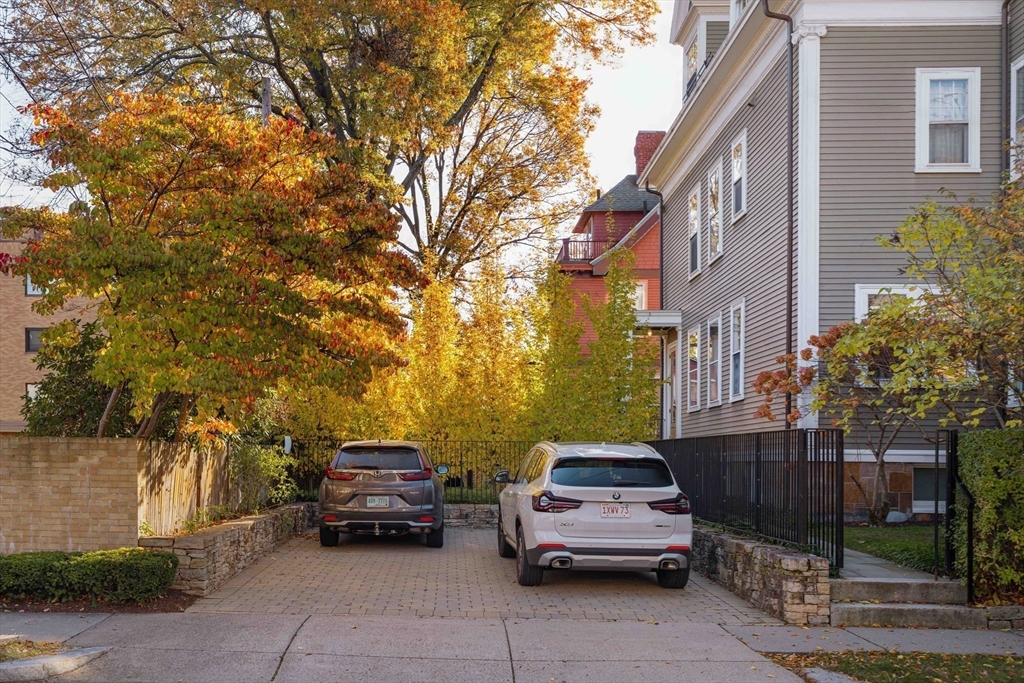 61 Centre Street Brookline, MA 02446 - Photo 29 of 31 a car parked in front of brick building