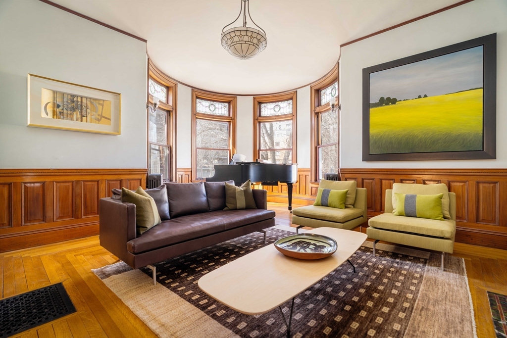 61 Centre Street Brookline, MA 02446 - Photo 4 of 31 a living room with furniture and a flat screen tv