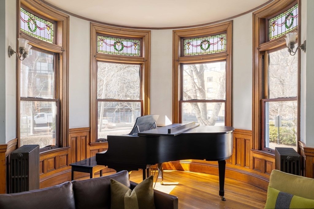 61 Centre Street Brookline, MA 02446 - Photo 5 of 31 a view of a livingroom with workspace window and wooden floor