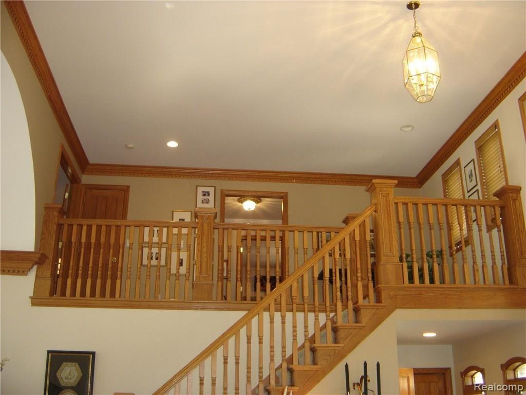 2829 Six Mile Road South Lyon, MI 48178 - Photo 37 of 46 Custom oak staircase and moldings.