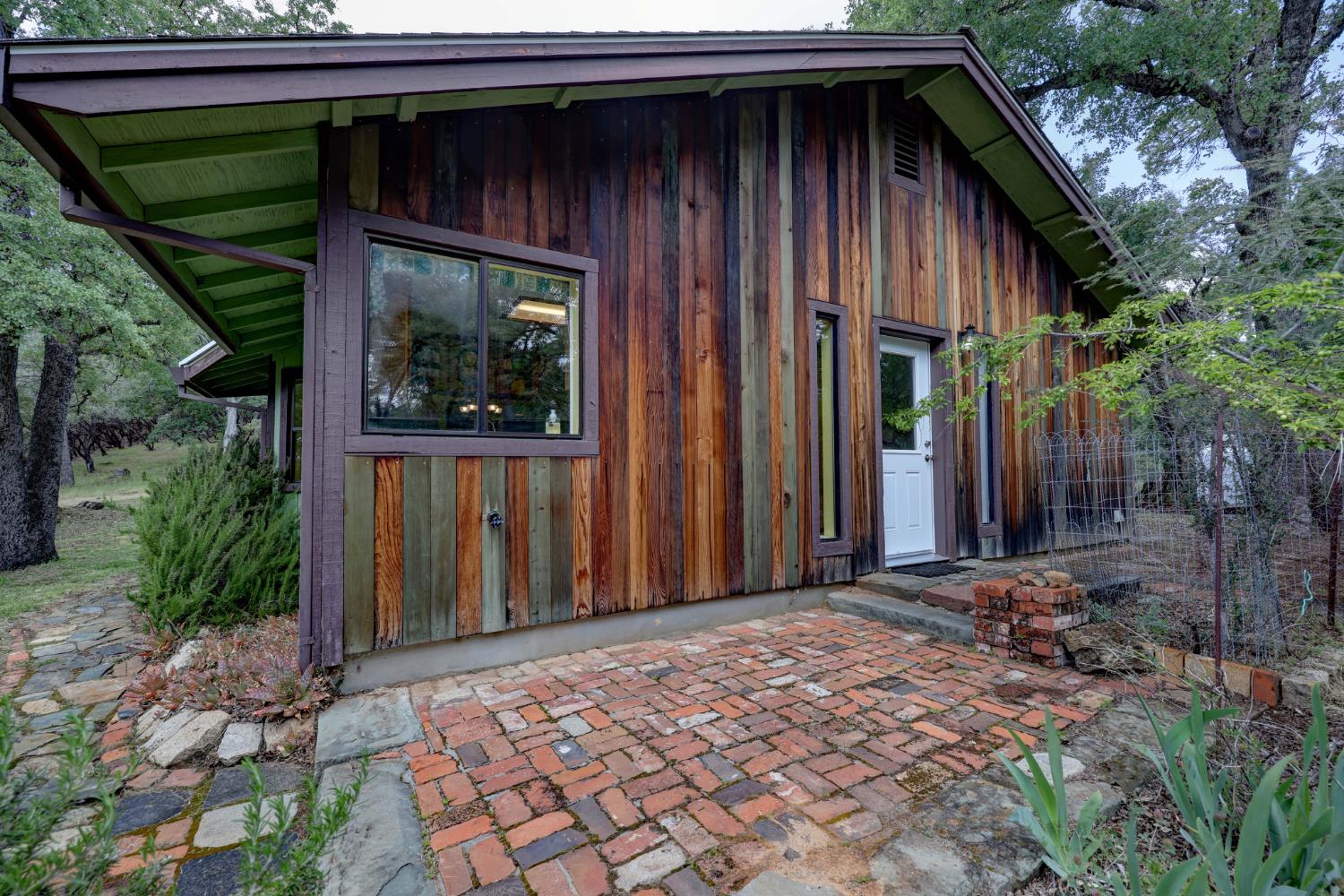 1480 Sage Road Colfax, CA 95713 - Photo 28 of 52 two sides of the home featuring clear, redwood siding in warm rustic tones.