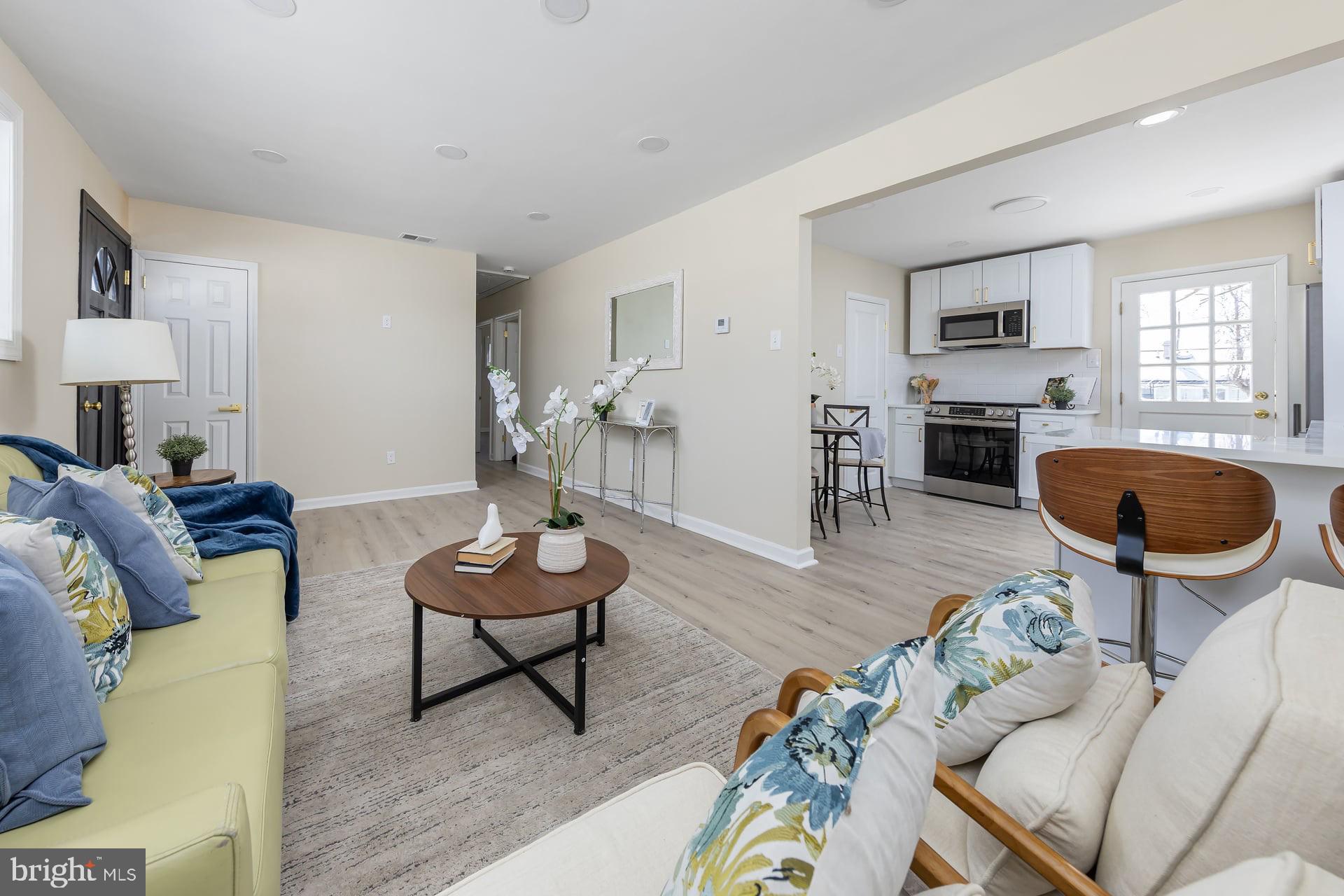 1117 Monmouth Road Deptford, NJ 08096 - Photo 5 of 18 a living room with furniture and a wooden floor