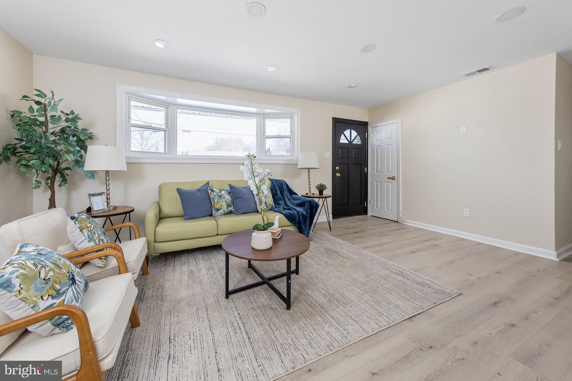 1117 Monmouth Road Deptford, NJ 08096 - Photo 6 of 18 a living room with furniture and a window
