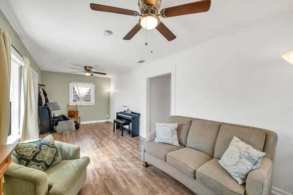 a bedroom with furniture and a window