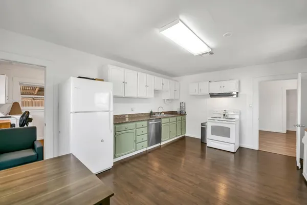 a room with cabinets and washer dryer