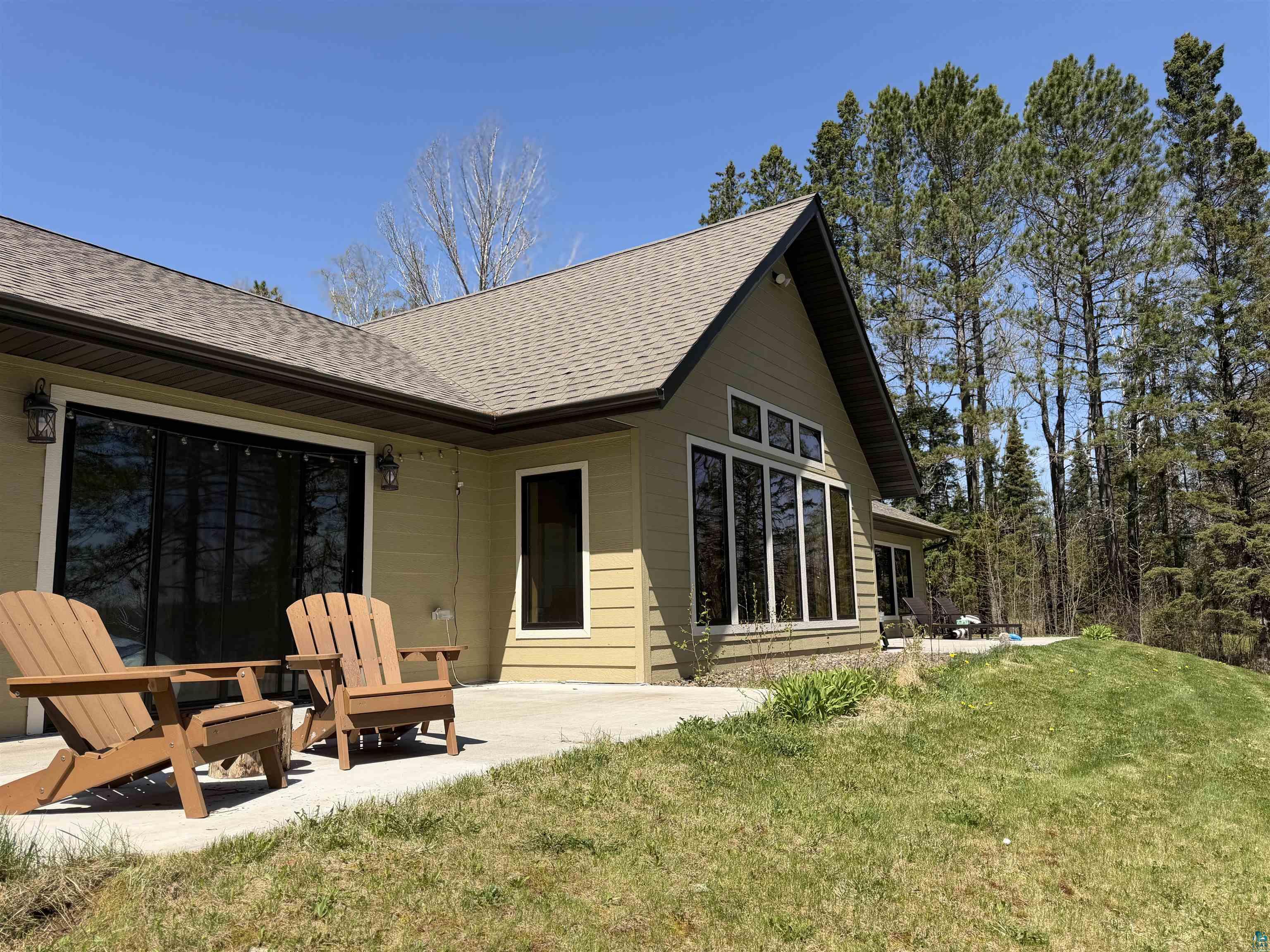 5274 Marble Lake Road Two Harbors, MN 55616 - Photo 57 of 79 Exterior featuring a gable roofline, light-toned siding, and a concrete patio