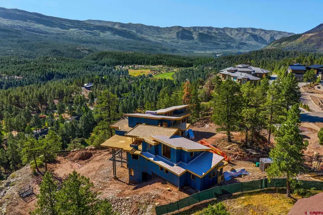 an aerial view of a house with a garden