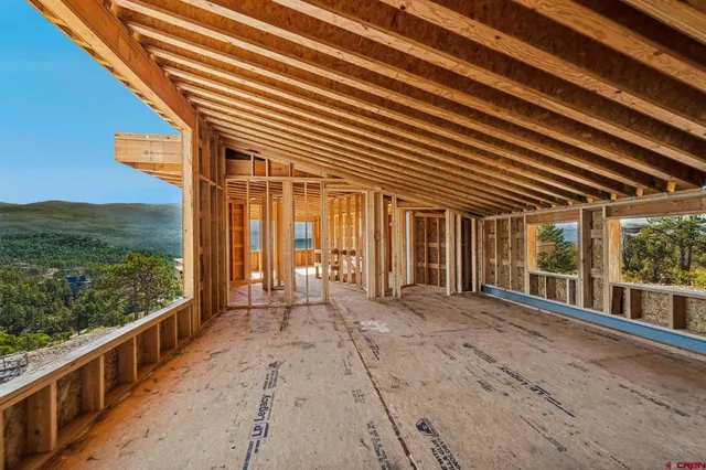 a view of a room with wooden walls
