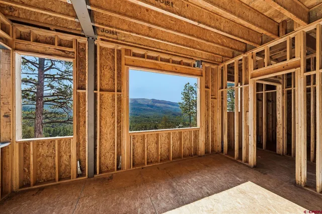 an aerial view of a house with a garden